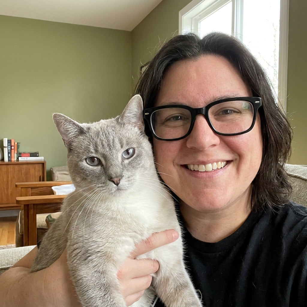 files/Person_holding_cat_at_home_202608290040.jpg